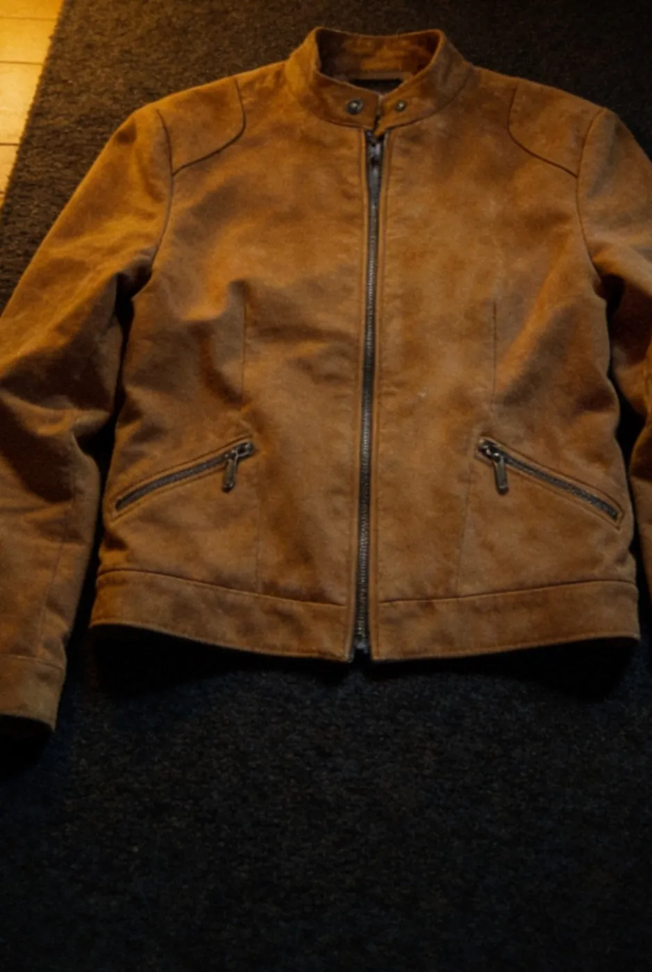 Plain brown jacket laid flat